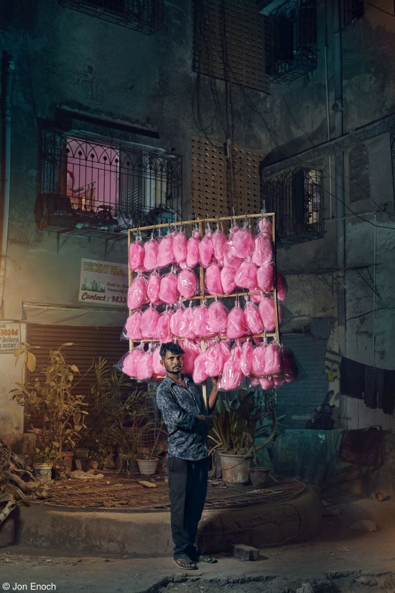 Pappu Jaiswal - a candyfloss seller in Mumbai, India holds his display of brightly coloured confectionery on the streets near to Versova Beach. Never more popular than in the age of social media for some eye-catching likes, the pink sugar clouds are popular for those looking for an affordable treat.